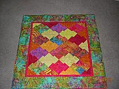 Hug with Batiks |  http://www.flickr.com/photos/28328779@N00/3562527401/This is a Hug Quilt for my...