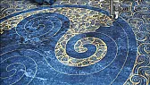 Celtic triskelion wall hanging quilted in gold on deep blue |  The toughest stretch here seems to me to be the dense free-motion fill in the...