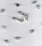 illusion necklaces  |  I make them with sterling or gf mini-crimps, pearls and Swarovski, have not...