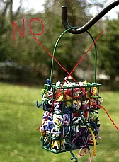 Floss scraps for birds?  Don't do it ...  |  Yes, I read it.  Natural ones are in the suggested materials you *can* use: "If...